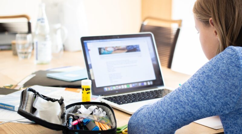 Students learning with technology in a modern classroom setting