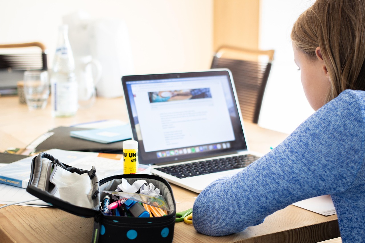 Students learning with technology in a modern classroom setting